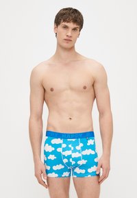 Μπλε εσώρουχο με σχέδιο σύννεφο, ελαστικό ύφασμα, ελαστική μέση με το κείμενο «HAPPY» και στενή εφαρμογή.