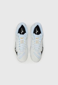 Light blue athletic shoes with a mesh design, black accents, and orange detailing. Features laces and a cushioned sole.