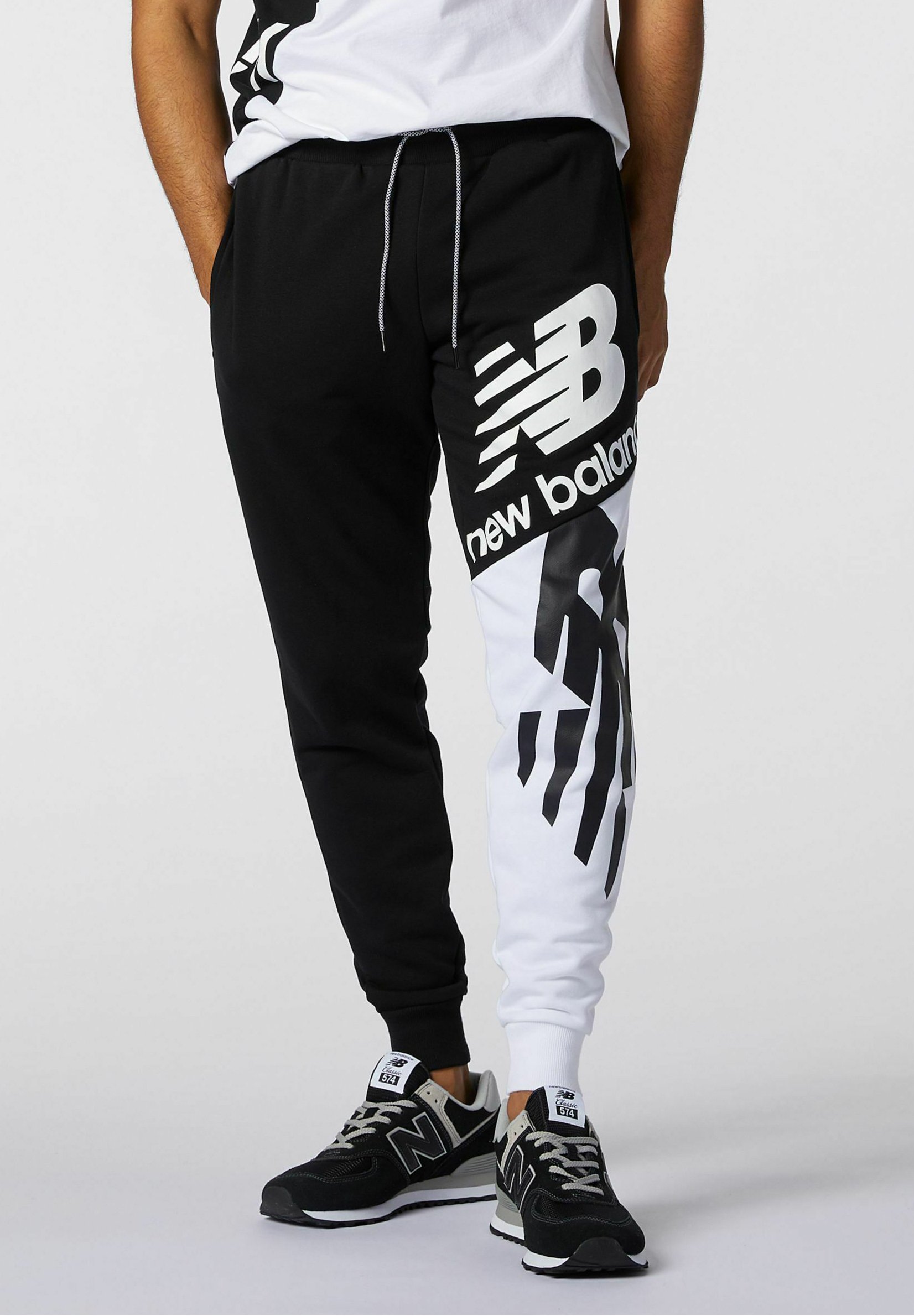 New Balance NB ATHLETICS SPLICE - Pantalones deportivos - black/blanco -  Zalando.es