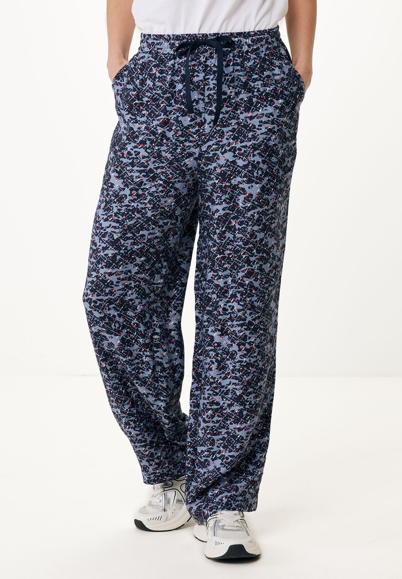 Pantalons de lounge à motifs en bleu marine avec des designs abstraits en gris clair et rouge. Dotés d'une taille élastique, d'un cordon de serrage et de poches latérales.