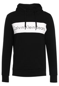 Felpa nera con cappuccio realizzata in tessuto morbido, caratterizzata da una fascia orizzontale bianca con il marchio "Calvin Klein Jeans". Include un cappuccio regolabile e polsini a costine.