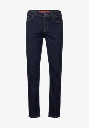 Granatowe dżinsy o slim fit, z pięcioma kieszeniami, zamkiem błyskawicznym i kontrastującymi żółtymi stawami.