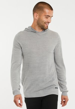 Grijze hoodie met lange mouwen en een relaxte pasvorm, gemaakt van zachte, gestructureerde stof. Beschikt over een capuchon en ribbelboorden aan de mouwen en onderkant.