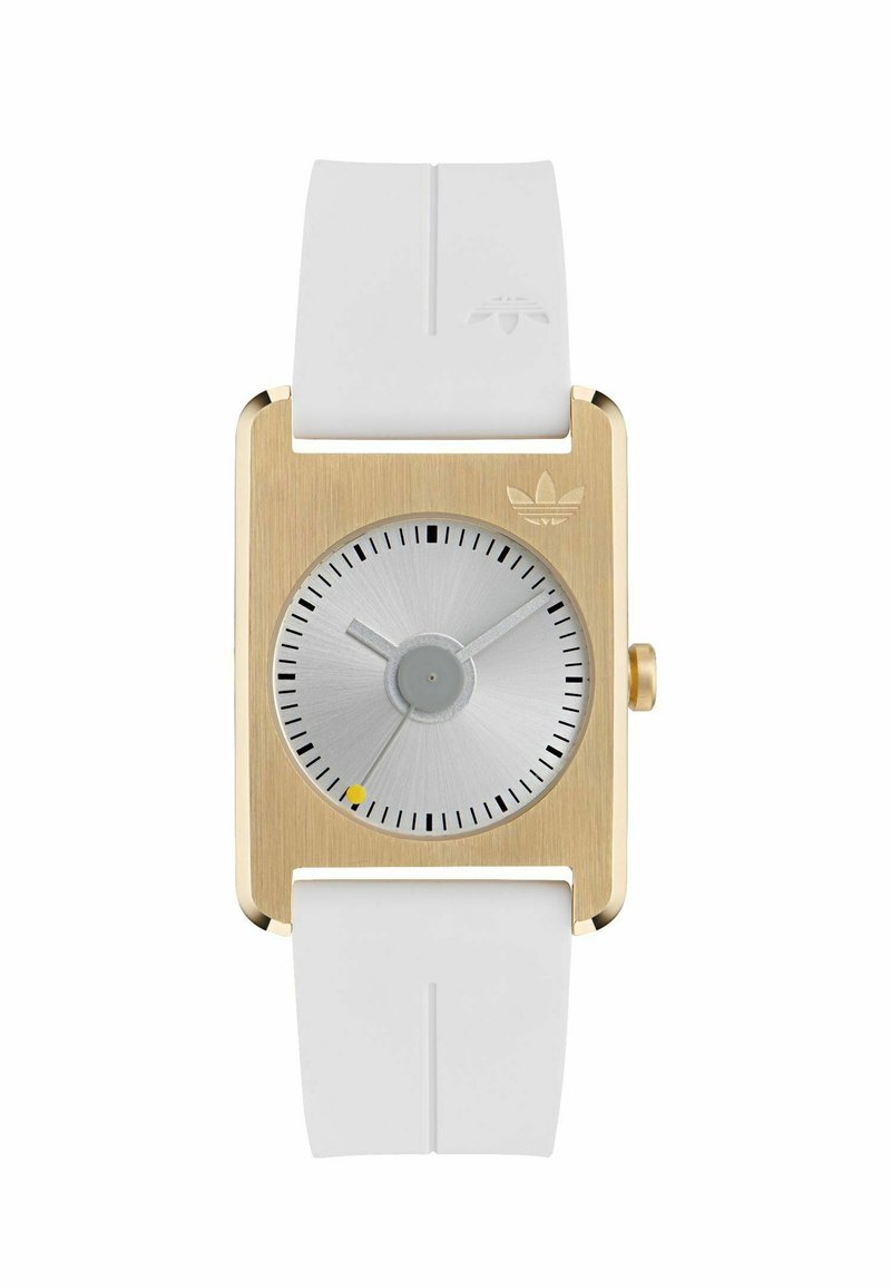Square gold-tone watch with a silver dial, white silicone strap, black hour markers, and a small yellow accent near the center.