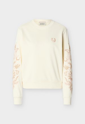 Crèmewitte sweatshirt met lange mouwen en ronde hals, met een klein geborduurd hoefijzer op de borst en een ingewikkeld bloemmotief langs beide mouwen.