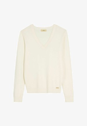Kremowy sweter z dekoltem w serek, długimi rękawami, ściągaczami na mankietach i u dołu, o minimalistycznym wzorze oraz z małą złotą metką marki przy dole.