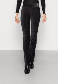 Calvin Klein Jeans VELVET SKINNY PANTS - Calças - black