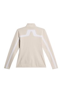 Giacca atletica beige con colletto alto, maniche lunghe e strisce bianche d'accento sulle spalle e sulle maniche. Texture liscia.