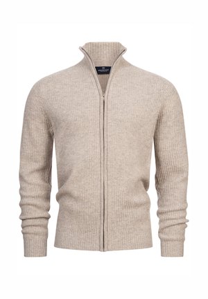 Beige zip-up trui van ribstof. Bevat een hoge kraag en lange mouwen met aansluitende manchetten. Eenvoudig ontwerp zonder patronen of metalen onderdelen.