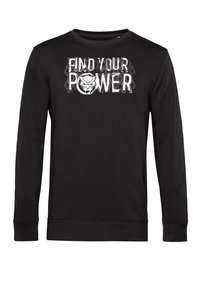 Sudadera negra de manga larga hecha de algodón, que presenta el texto "ENCUENTRA TU PODER" y un diseño geométrico sobre un emblema de cara estilizada.