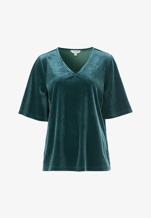 Tegenblauw fluwelen top met een V-hals, korte mouwen en een losse pasvorm. De stof heeft een gladde textuur en een subtiele glans. Zorglabel zichtbaar.