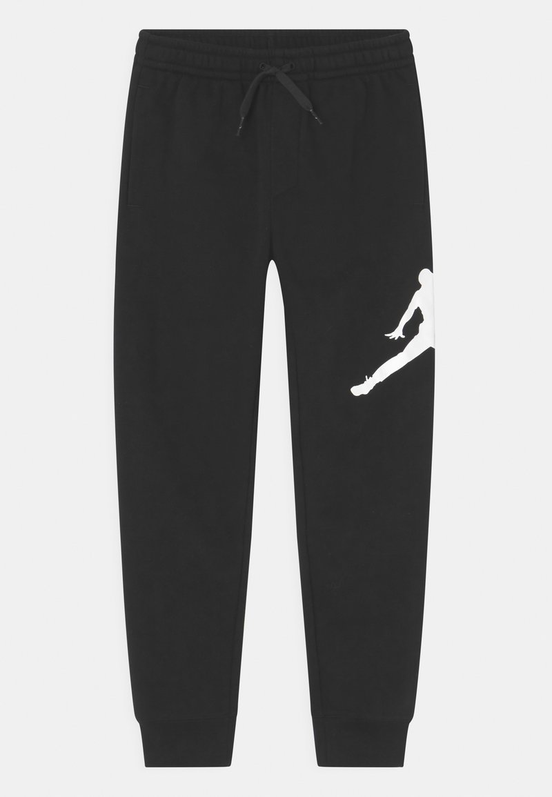Zwarte joggingsbroek gemaakt van zacht materiaal, met een elastische tailleband en trekkoord. Kenmerkt zich door een witte silhouetafbeelding op de onderbenen.