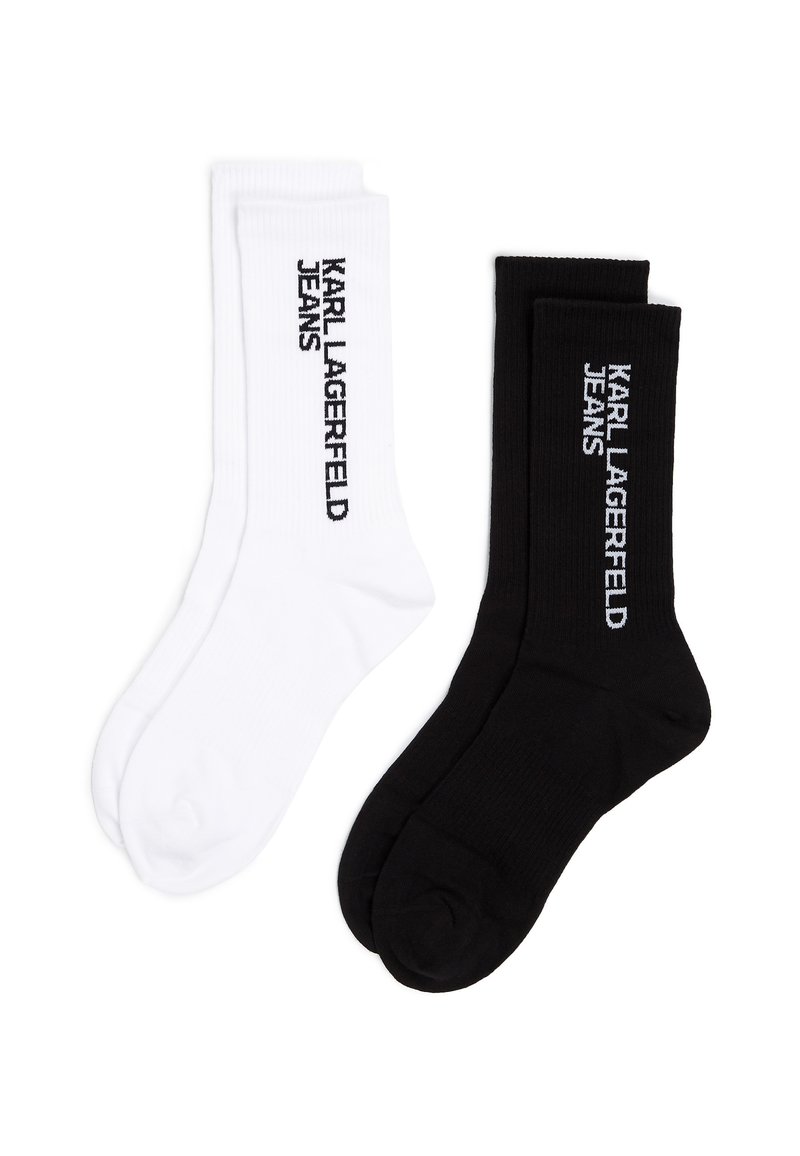 Dos pares de calcetines de algodón, uno blanco y otro negro, con el texto "KARL LAGERFELD JEANS" en colores contrastantes. Textura de canalé.