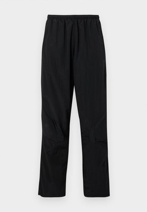 adidas Originals ADICOLOR 2000S WOVEN TRACK LOOSE - Spodnji deli trenirk - black