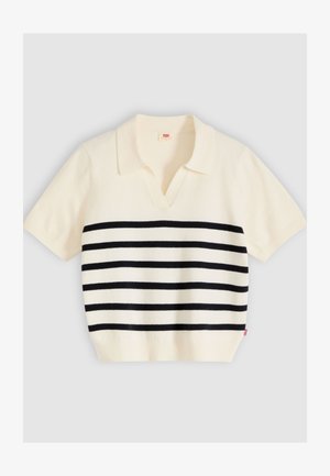 Polo de punto crema de manga corta con rayas horizontales negras, cuello abierto y dobladillo acanalado, presentado extendido sobre un fondo gris.