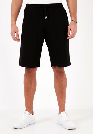 REGULAR FIT - Pantaloni de trening - black