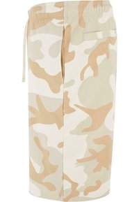 Beige camouflage shorts made of soft fabric, featuring an elastic waistband with drawstring, side pockets, and a back pocket detail.