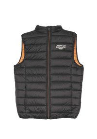 Chaleco acolchado negro con cuello alto, cierre de cremallera y forro interior naranja. Presenta paneles cosidos y la marca "URBAN CO" en el pecho.
