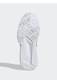 Semelle blanche de basket Adidas avec un motif de bande de roulement texturé et le logo Adidas à l'arche, présentée sur un fond clair uni.