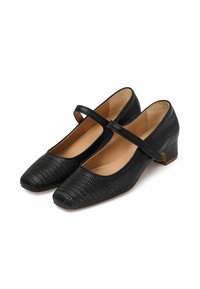 Scarpe nere in pelle sintetica con punta quadrata e tacco basso a blocco. La superficie texturizzata presenta un motivo simile alla pelle di rettile. Include una fascia decorativa.