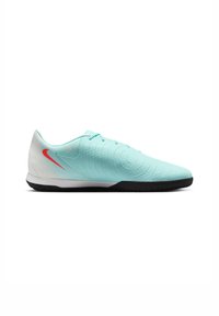 Hele sinised spordijalatsid tekstuurse pealmise osaga, ümar kuju, valged aktsendid, punane Nike logo ja must kummist tall. Omab ringikujulisi mustreid.