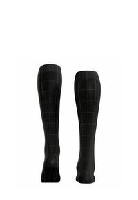 Calze nere al ginocchio con un motivo a griglia verde scuro. Realizzate in un materiale liscio e elastico con una forma aderente.