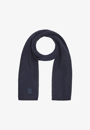 Écharpe en tricot bleu marine avec un motif en côtes texturé et une petite étiquette de logo à une extrémité, conçue pour la chaleur et le confort par temps froid.
