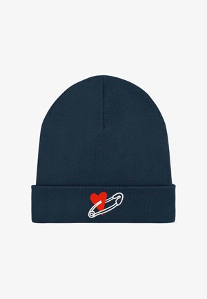 Tamsiai mėlynas mezginys su manžetė, priekyje siuvinėtas baltas saugos smeigtuko piešinys su raudonos širdies akcentu.