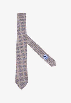 Cravate beige clair ornée d'un motif floral bleu répétitif. Le tissu semble lisse, avec une étiquette sur l'extrémité étroite affichant la marque.