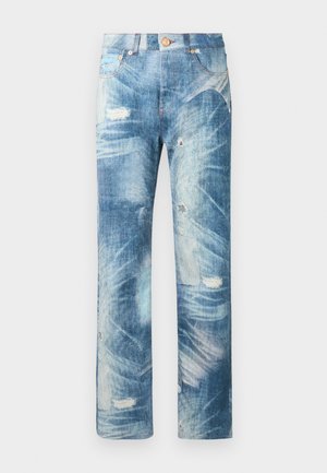 Blue distressed denim jeans with faded patches, whiskering effects, and slight rips, featuring front pockets and a button closure.