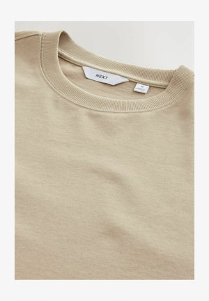 Beige crew-neck sweatshirt lavet af tekstureret stof. Ribbet krave og manchetter. Mærket synligt indeni, der angiver brand og størrelse (M).