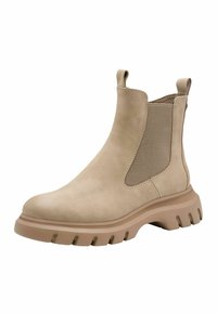 Bottes Chelsea en cuir beige avec des panneaux latéraux élastiques et des languettes de tirage, dotées d'une semelle en caoutchouc épaisse avec un motif de traction texturé.