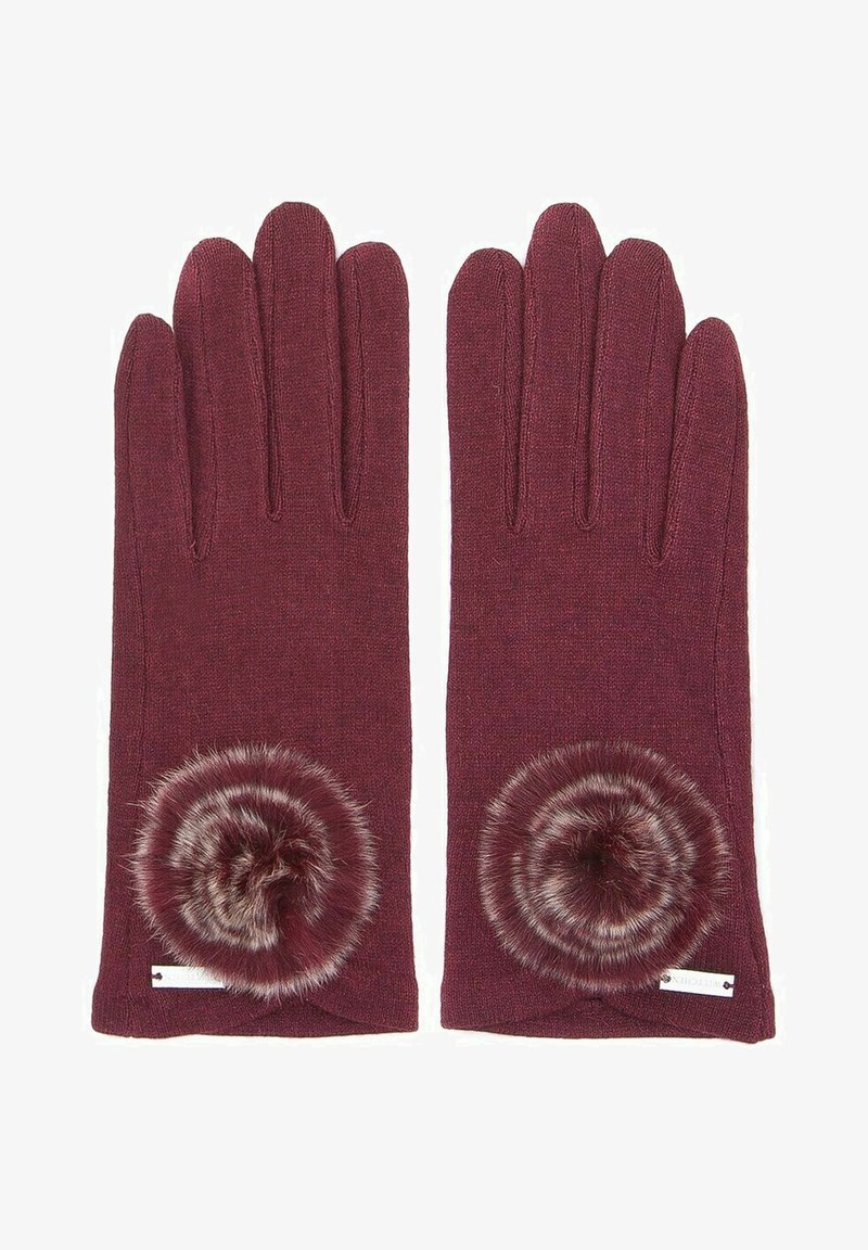 Burgunderfarbene gestrickte Handschuhe mit einem kreisförmigen, fellartigen Pompon-Akzent am Handgelenk. Strukturiert, schmal geschnitten und ohne sichtbare Beschläge.