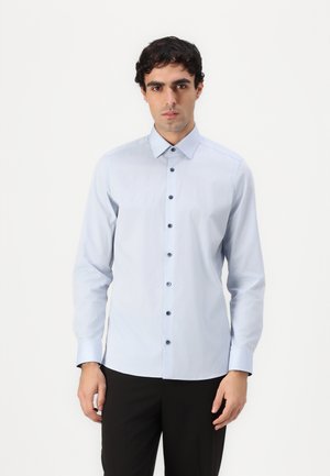 Light blue button-up shirt with long sleeves, contrasting navy buttons, and a classic collar. Smooth fabric with a subtle sheen.