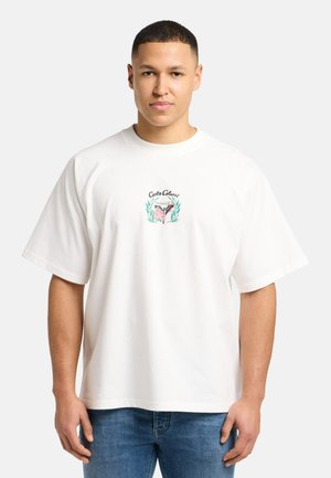White cotton t-shirt with short sleeves, featuring a front graphic of leaves and flowers, round neckline, and relaxed fit.