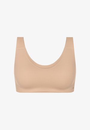Nahtloser beiger Sport-BH mit breiten Trägern und Rundhalsausschnitt, entworfen für Komfort und Unterstützung.