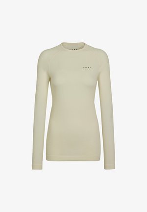 Light beige long-sleeve top with a textured surface, crew neckline, and subtle branding on the front. Made from stretchy material for comfort.