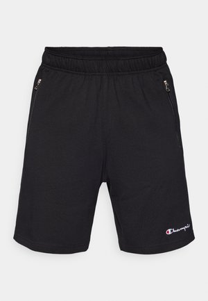 Shorts atléticos negros con cinturilla elástica, que cuentan con dos bolsillos laterales con cremallera y un pequeño logotipo bordado en el dobladillo.
