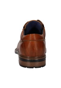 Braune Lederschuhe mit runder Ferse. Verfügen über einen strukturierten Rücken und einen gepolsterten Kragen, mit sichtbarer kontrastierender Innenauskleidung. Gummisohle.