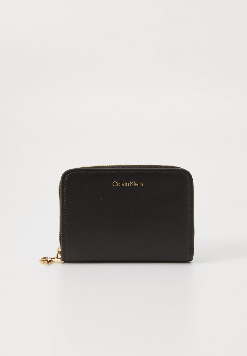 Black leather zip-around wallet with gold hardware, featuring a debossed logo on the front and a smooth texture. Rectangular shape.