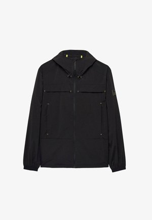 Melnā jaka ar kapuci, ar divām krūšu kabatām, priekšējo rāvējslēdzēju un dzelteniem akcentiem. Gluda tekstūra, viegls dizains.