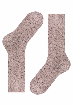 Chaussettes tricotées avec un motif texturé, dominé par un rouge clair et des éclats de couleurs plus foncées. Présentent une bordure côtelée et un orteil arrondi.