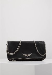 Black leather handbag with a silver chain strap, zip closure, and decorative wing emblem. Features studs along the bottom edge.