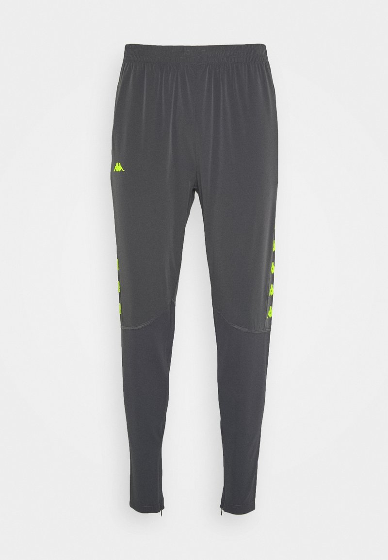 Ciemnoszare spodnie sportowe z elastycznym pasem, zwężanymi nogawkami, neonowo-żółtymi logo po bokach oraz przeszyciami na wysokości kolan.