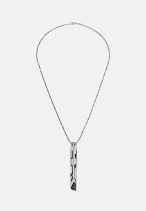 Silver chain necklace with a vertical rectangular pendant featuring abstract black and silver geometric patterns.