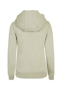 Gaiši zaļa kapuce ar plašu kapuci, ribota apkakle un apakšmala. Gluda tekstūra ar minimālu šuvju skaitu un vienkāršu, tīru dizainu.