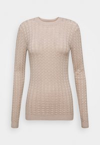 Maglione beige lavorato a maglia con una texture di cerchi sovrapposti. Presenta un collo rotondo e maniche lunghe, rifiniti con polsini e orlo a coste.