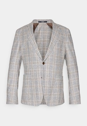 Švarkas su laukeliu šviesiai pilkos spalvos, su rudi akcentais, pagamintas iš tekstūruotos medžiagos, su vienu mygtuko uždarymu ir įpjautomis apykaklėmis.