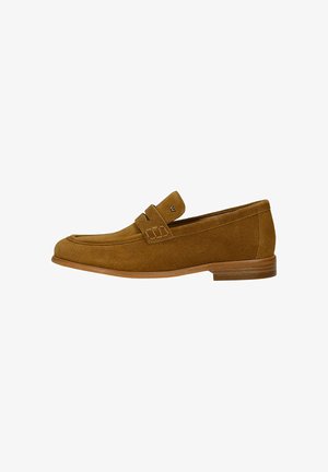 Brown suede men's loafer with low stacked heel and strap detail across the top, shown in side profile on white background.