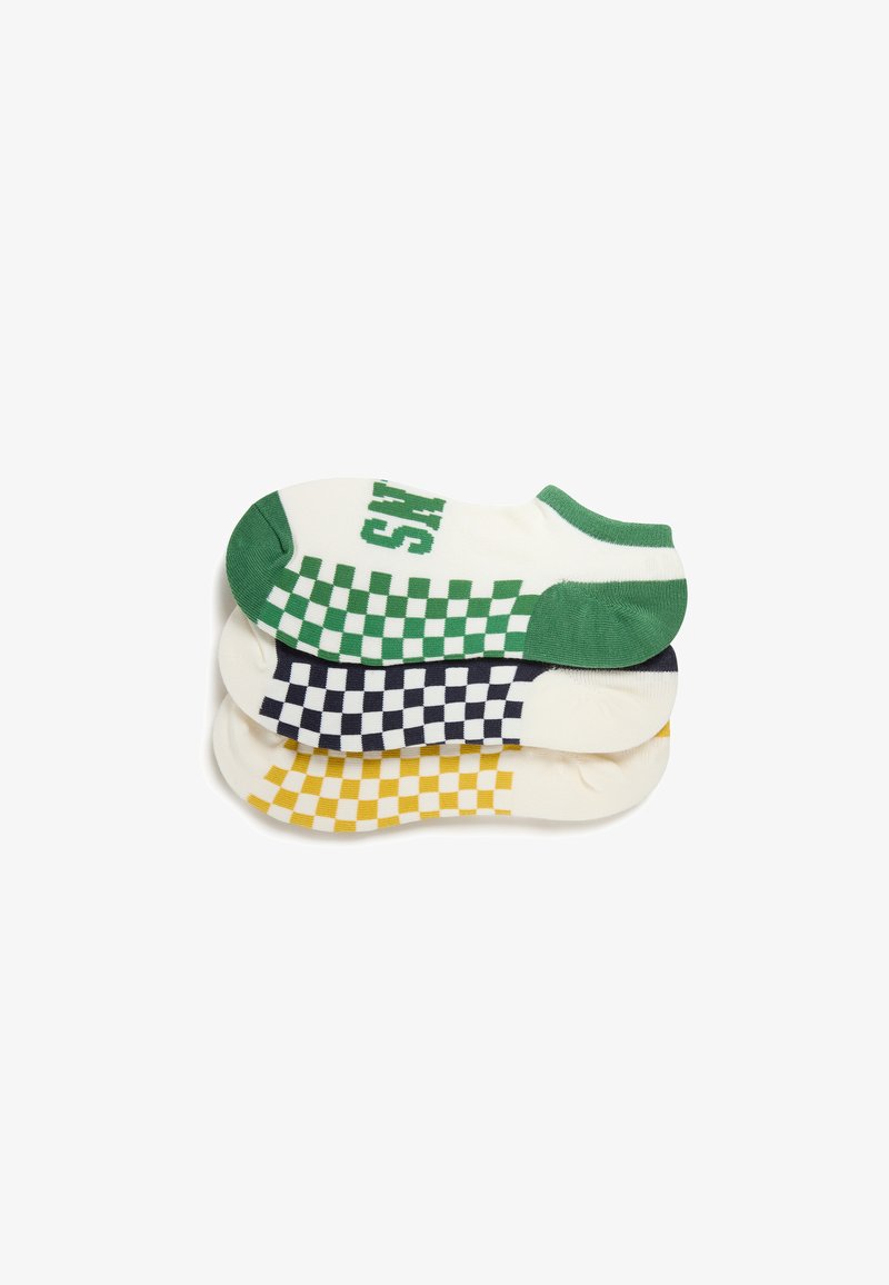 Chaussettes empilées présentent des motifs en damier blancs avec du vert, du bleu marine et du jaune. Tissu doux avec un design athlétique et à coupe basse.
